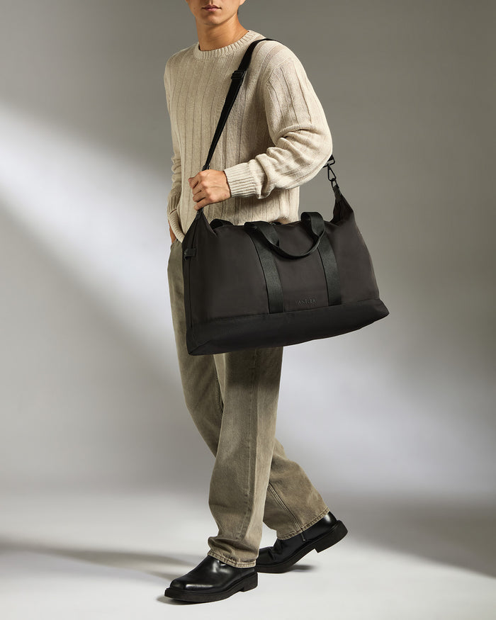 a man holding a bag