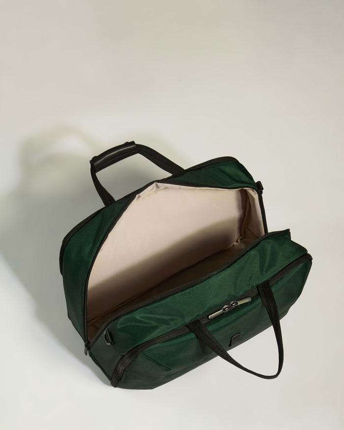 a green bag with a handle