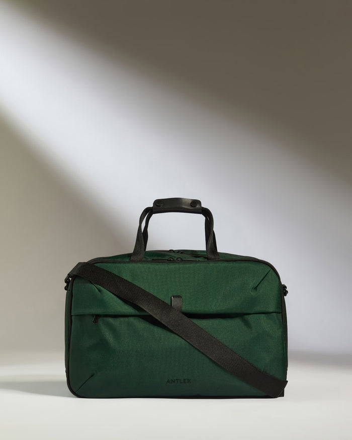 a green bag with a strap