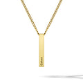 Gold necklace with a vertical bar pendant engraved with 'Cohen' on a white background