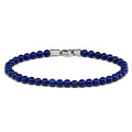 A bead bracelet made of blue lapis lazuli with a silver clasp, displayed against a white background.