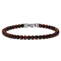 A bracelet made of round red beads with a polished finish, featuring a metal clasp.