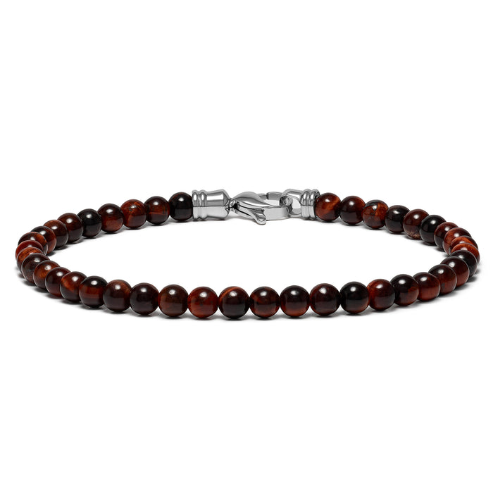 A bracelet made of round red beads with a polished finish, featuring a metal clasp.
