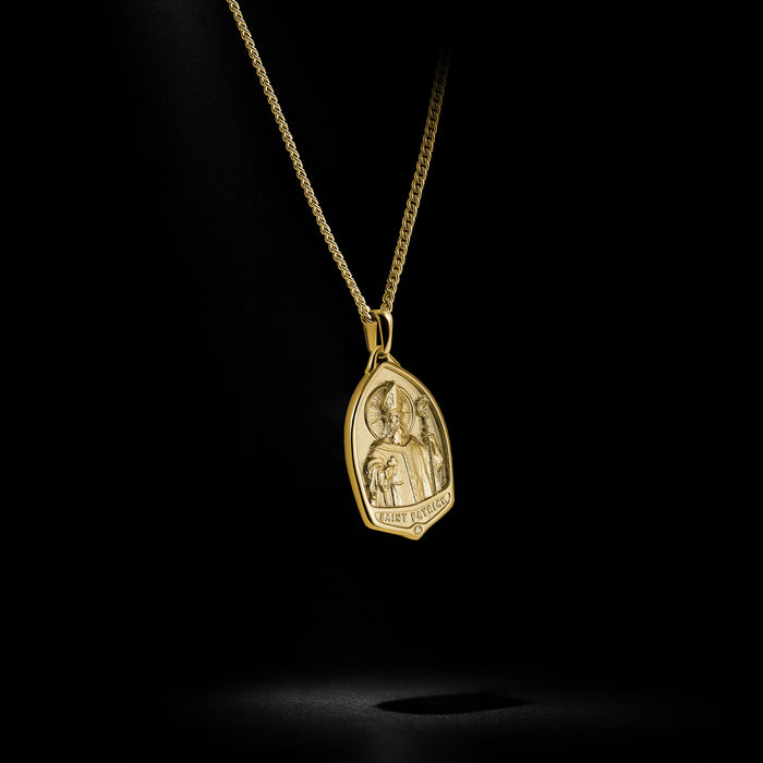 Gold pendant necklace on a black background
