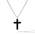 Black cross pendant on a silver chain against a white background