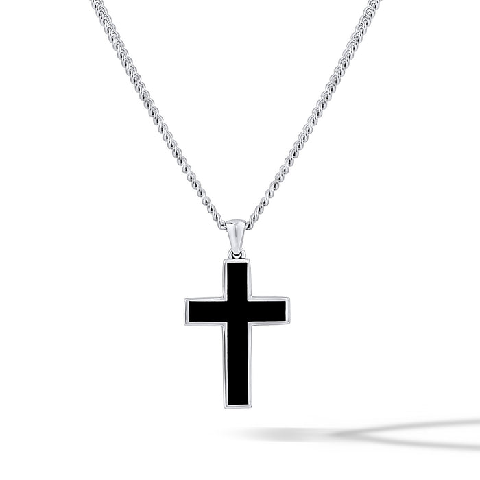 Black cross pendant on a silver chain against a white background