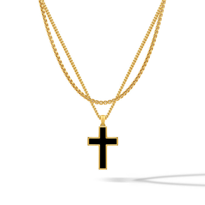 A gold-plated cross pendant on a two-layer gold box chain necklace against a white background.