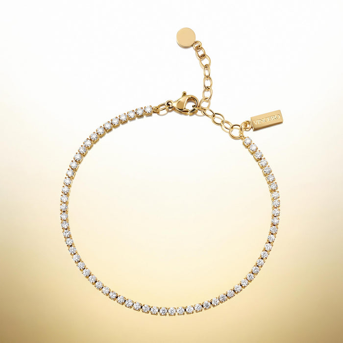Gold bracelet with clear stones on a gradient gold background
