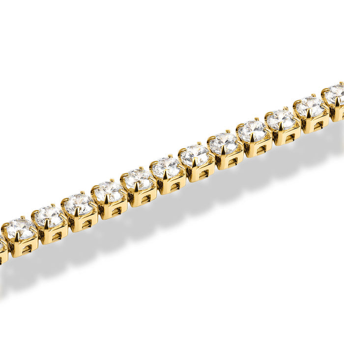 Gold bracelet with clear gemstones on a white background