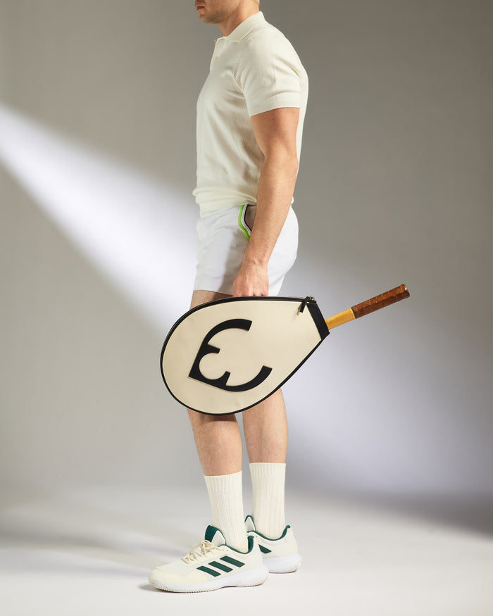 a man holding a paddle