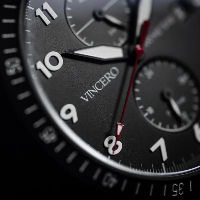 Close-up of a Vincero watch face with a blurred background