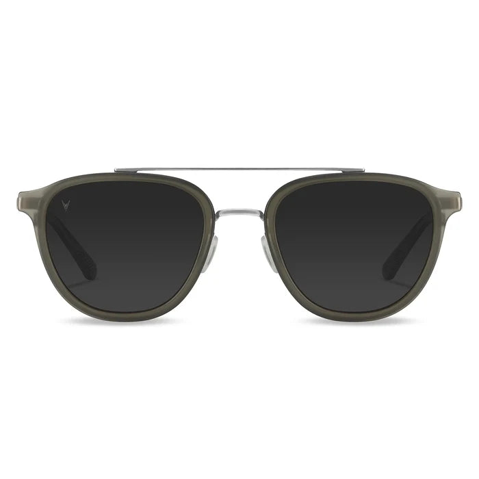A pair of round full frame sunglasses with a metal bridge and acetate temples, in a gray color.