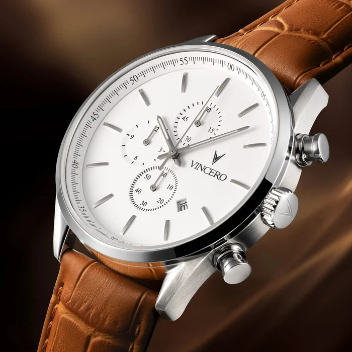 Vincero watch with brown leather strap on a dark background