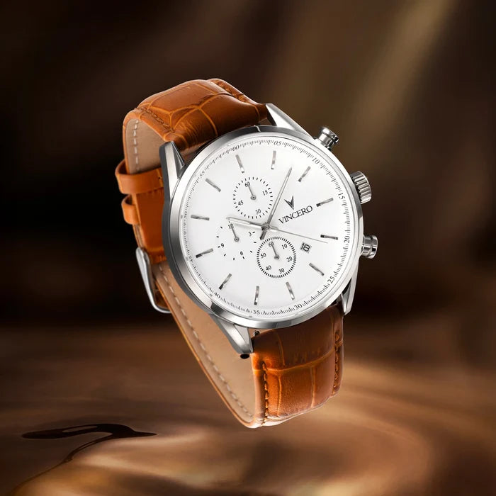 Watch with brown leather strap on a dark background