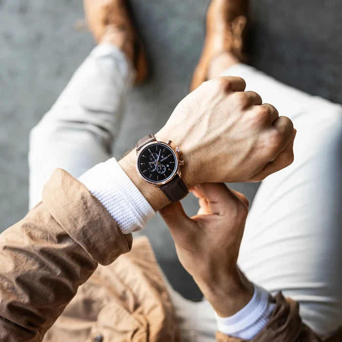 Person wearing a stylish watch with a blurred background