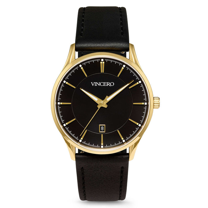 A Vincero dress watch with a black leather strap, gold case, and black dial with gold accents, including gold hour markers and a gold second hand. The watch shows a date display.