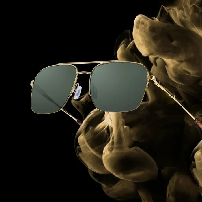 Sunglasses with reflective lenses on a dark background