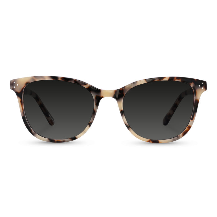 Sunglasses with tortoiseshell frame and dark lenses on a white background