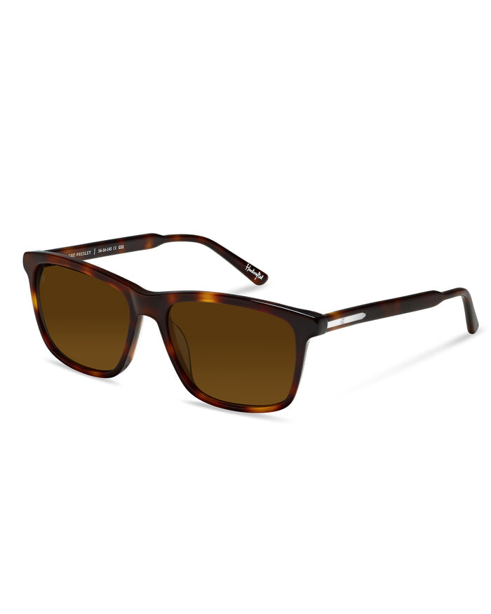 Sunglasses with tortoiseshell frame and brown lenses on a white background