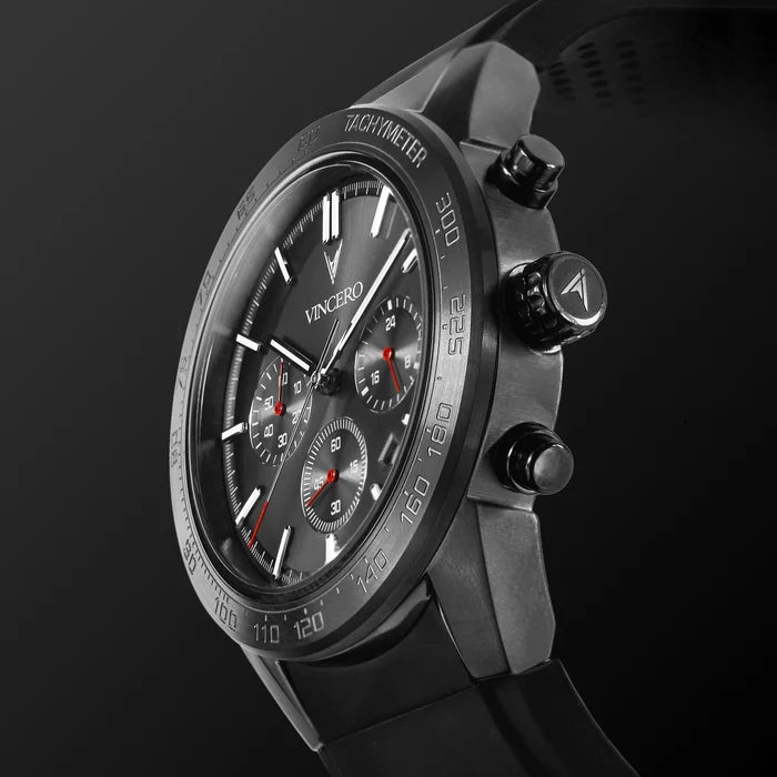 Black wristwatch with detailed face on a dark background