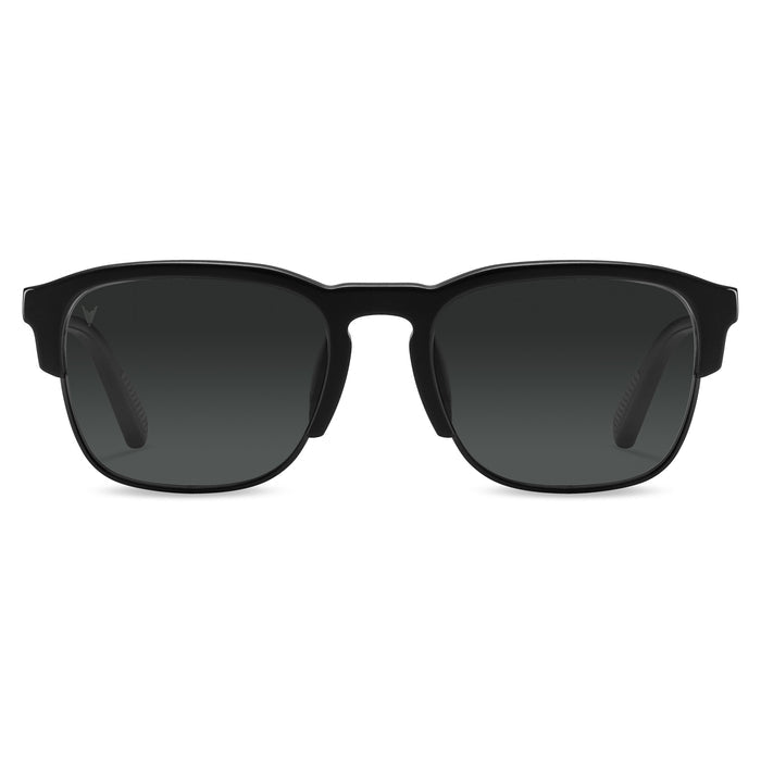 Black sunglasses with dark lenses on a white background
