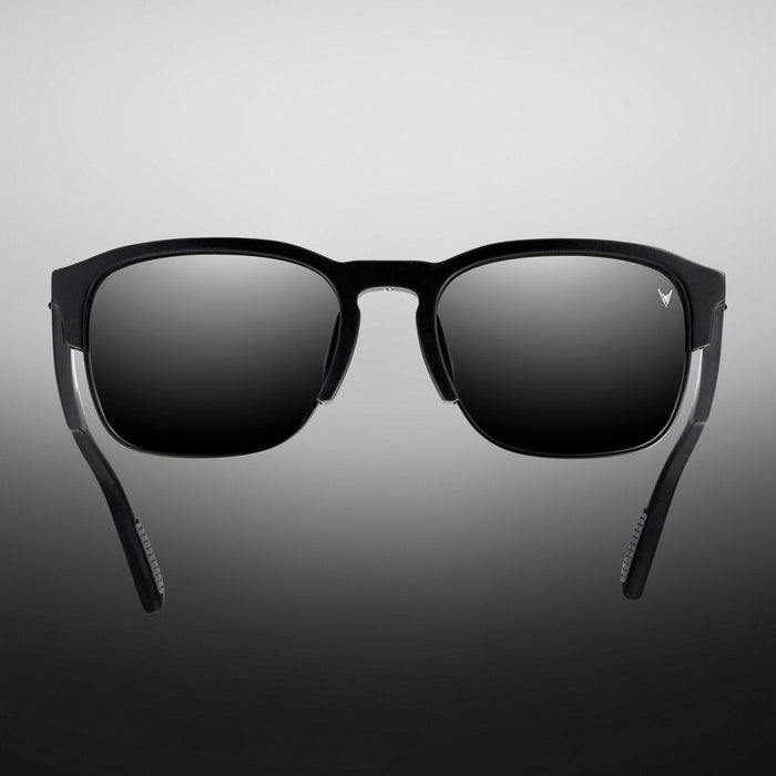 Black sunglasses with a gradient gray background