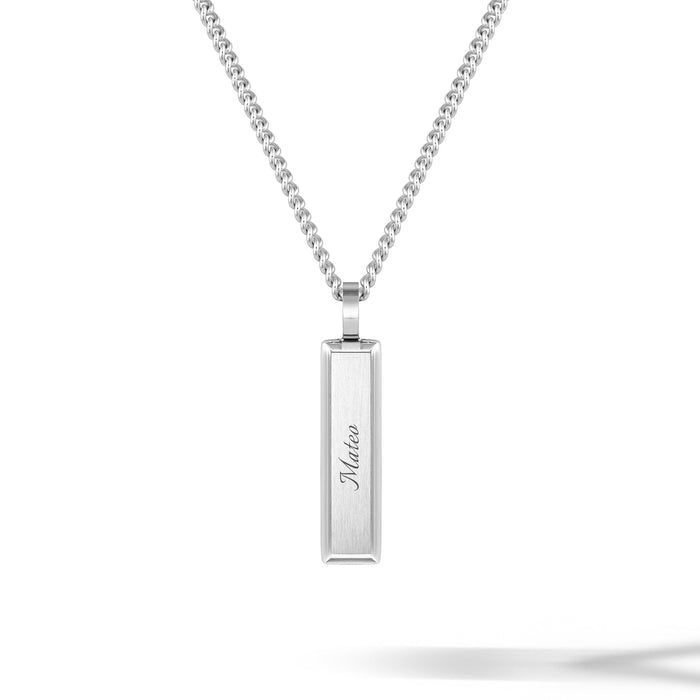 Silver necklace with a bar pendant on a white background