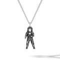 Astronaut pendant on a chain against a white background