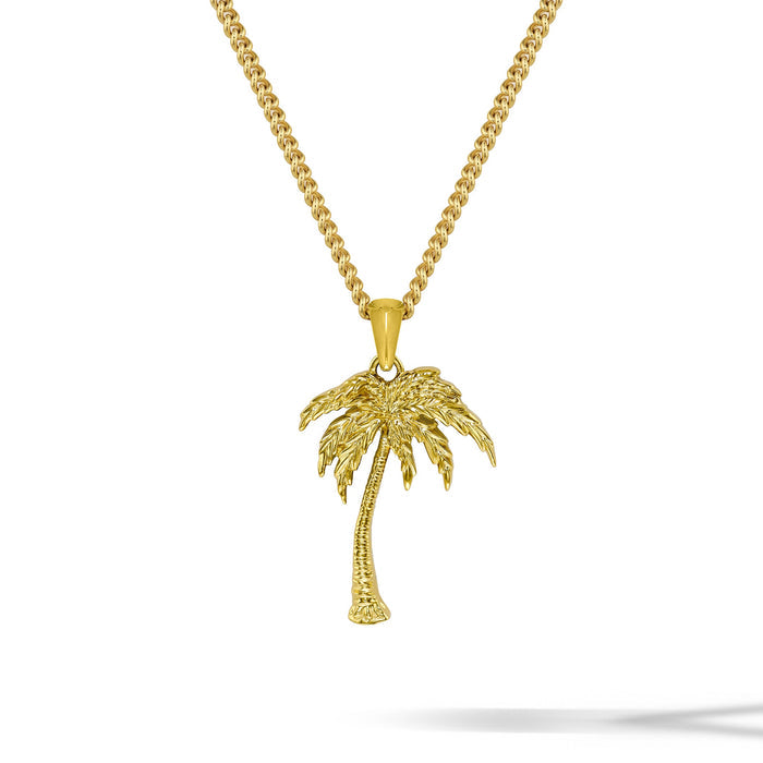 Gold palm tree necklace on a white background