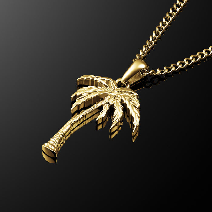 A gold palm tree pendant on a black background. This is a necklace for men.