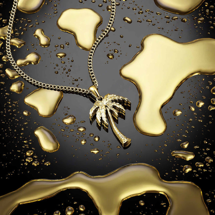 A gold palm tree pendant for men on black