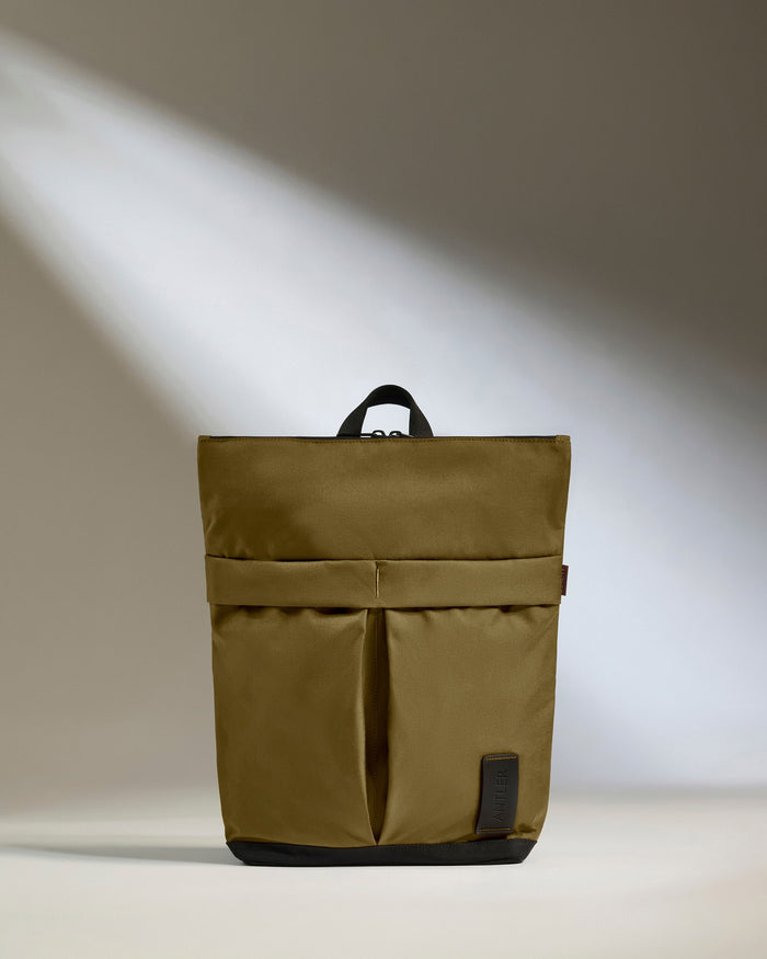 a brown bag with a black strap