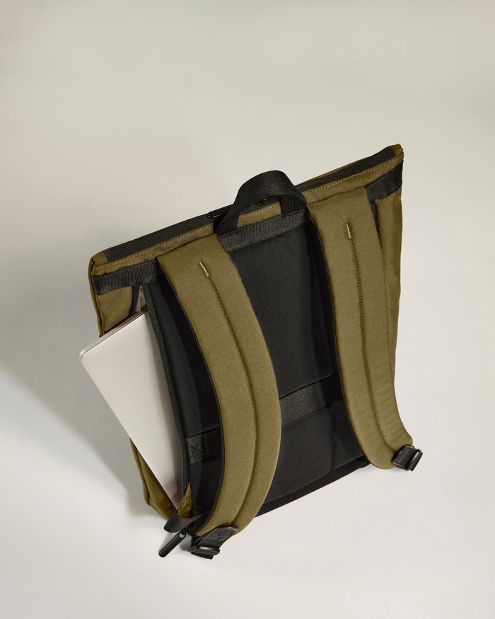 a backpack with a book in it