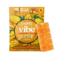 Mango flavored gummy bar with bright orange cubes and packaging showing sliced mangoes.
