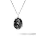 Silver necklace with a pendant featuring a black and white illustration of a woman's face on a white background
