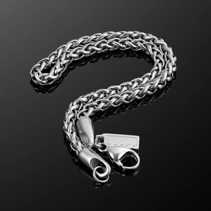 Silver chain bracelet with clasp on a black background